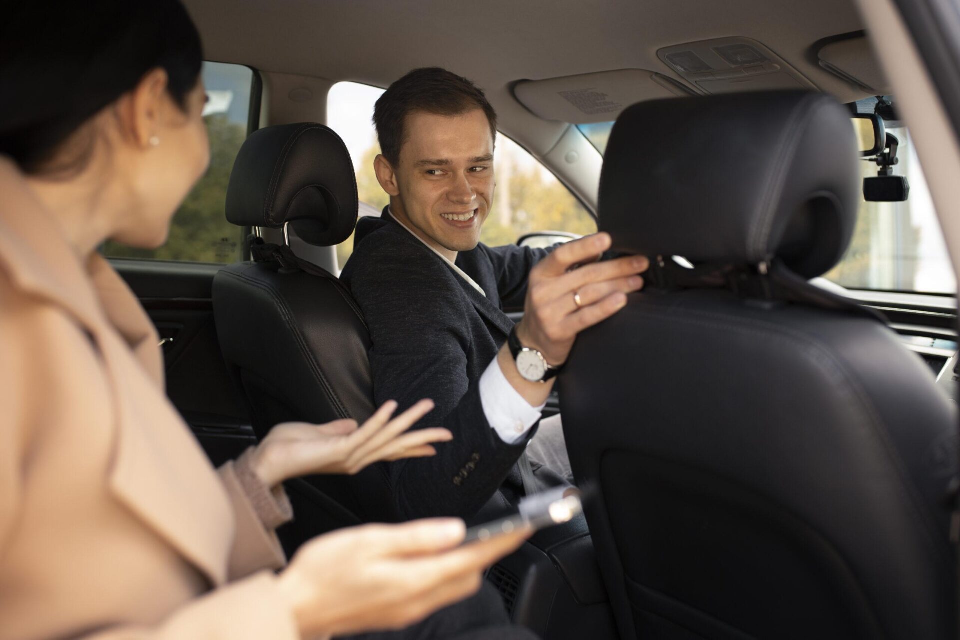 woman-talking-with-taxi-driver-car